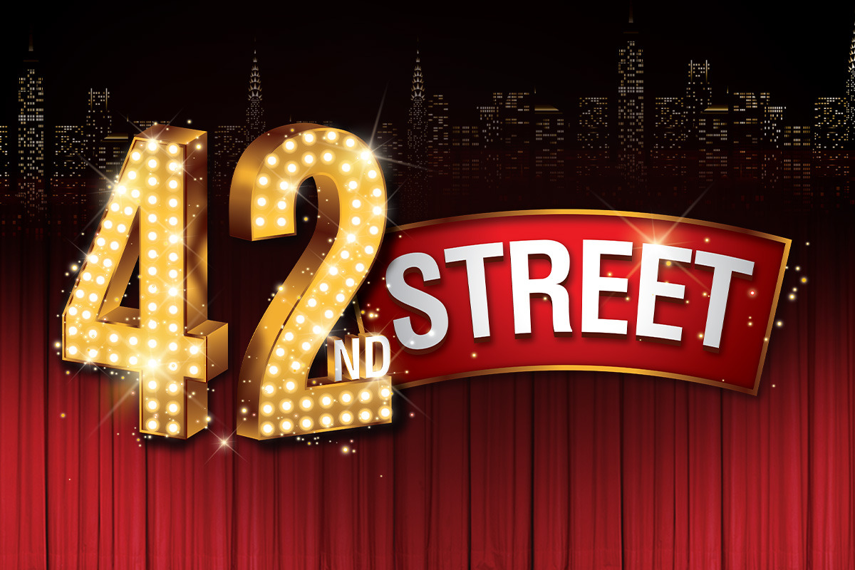 42nd Street logo in glowing Broadway style, with large gold marquee numbers “42” lit by white bulbs, the word “STREET” in bold white letters on a red banner, and a dark city skyline above red theatre curtains.