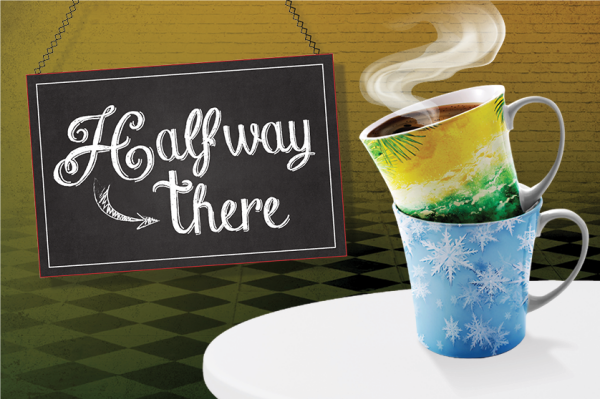 A playful graphic with a chalkboard sign that reads 'Halfway there' in decorative white lettering, with an arrow pointing down. Beside it, two stacked mugs are shown: the top mug has a tropical summer beach scene and is filled with steaming coffee, w