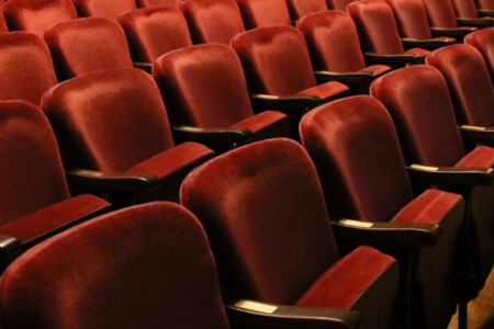 Red seats in a theatre auditorium