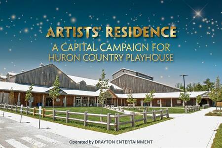Exterior of the Huron Country Playhouse, a rustic wooden theatre complex on a sunny day with a blue sky. Golden sparkles fill the upper part of the image. Bold gold and blue text reads: “ARTISTS’ RESIDENCE – A Capital Campaign for Huron Country Playh