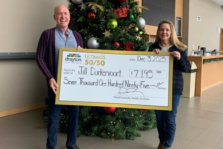 David Connolly presents a giant cheque to Jill Donkervoort, the winner of Drayton Entertainment’s Ultimate 50/50 Draw. The cheque is made out for $7,195.