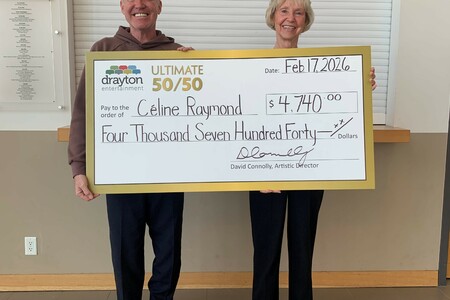 David Connolly presents a giant cheque to Celine Raymond, the winner of Drayton Entertainment’s Ultimate 50/50 Draw. The cheque is made out for $4,740.