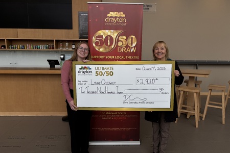 Director of Development Elizabeth Dwyer presents a cheque for $2,920 to Lynne Quigley at the Hamilton Family Theatre Cambridge.