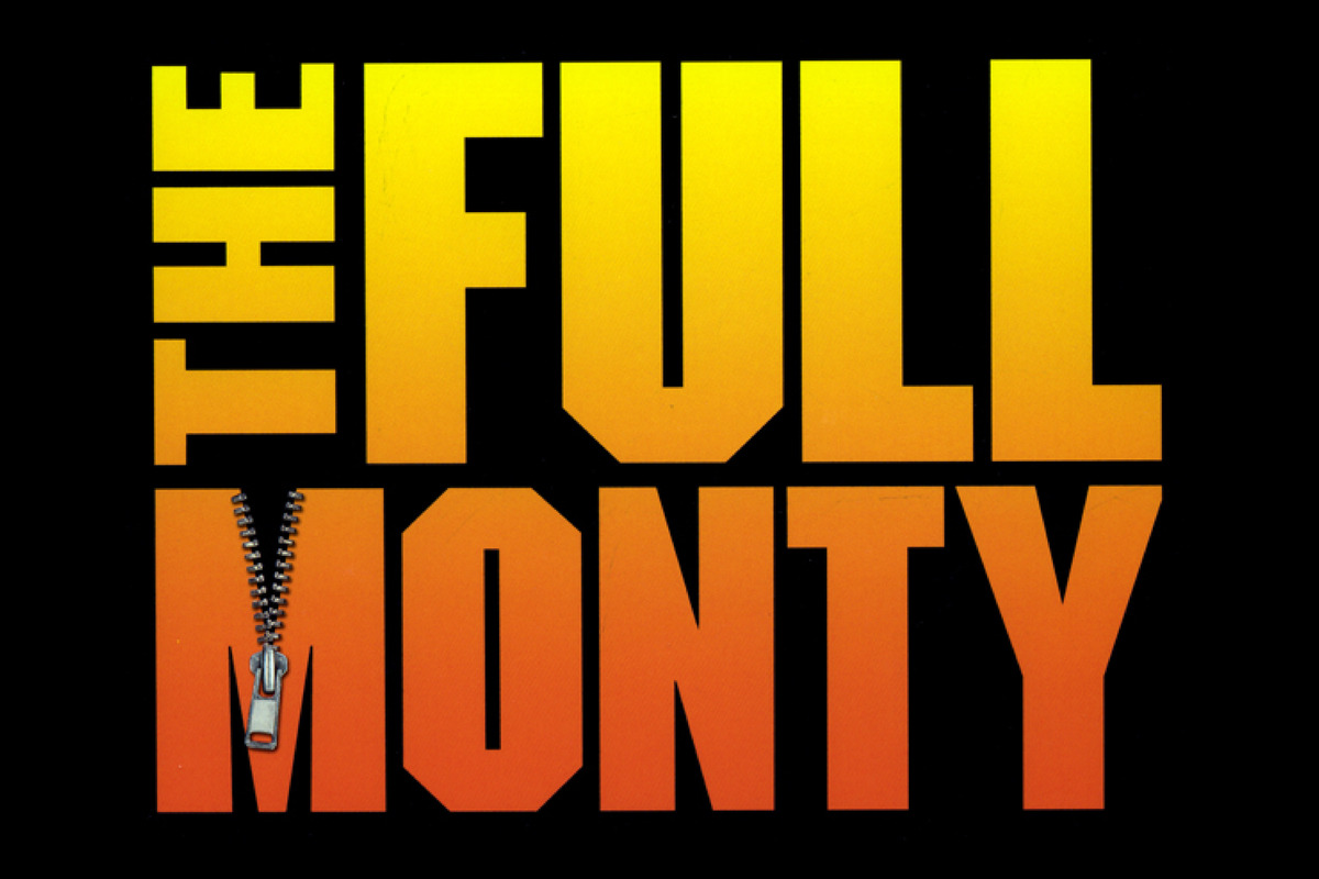 The title The Full Monty appears in bold silver letters against a dark blue starry background, illuminated by a soft spotlight that creates a theatrical, Broadway-inspired atmosphere.