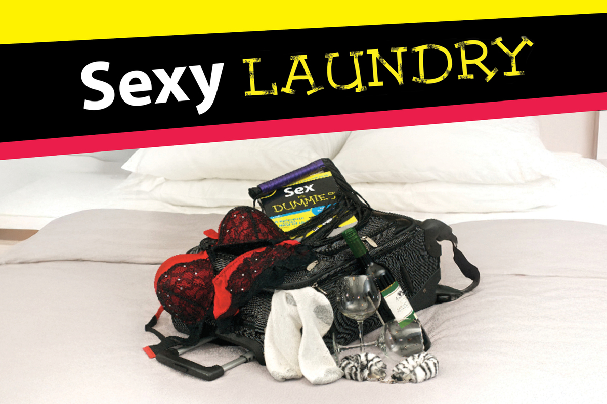 The title Sexy Laundry appears in bold silver letters against a dark blue starry background, illuminated by a soft spotlight that creates a theatrical, Broadway-inspired atmosphere.