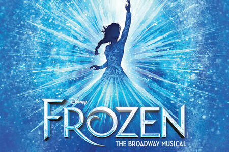 Blockbuster Broadway Musical appears in bold silver letters against a dark blue starry background, illuminated by a soft spotlight that creates a theatrical, Broadway-inspired atmosphere.