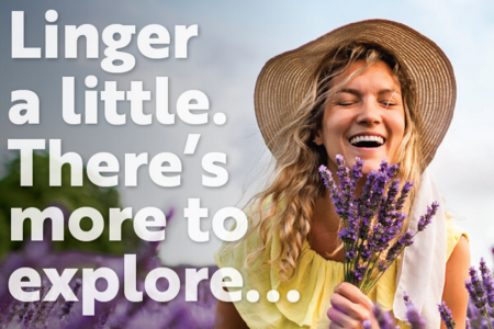 A woman smiling in a field of lavender with the phrase: 
